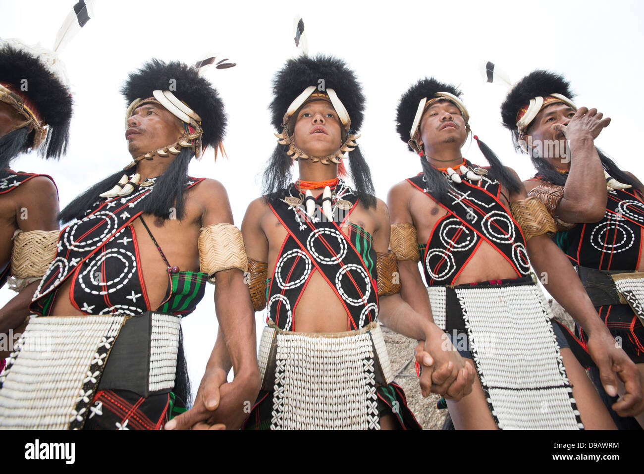 Naga tribal warriors in traditional outfit performing in Hornbill ...