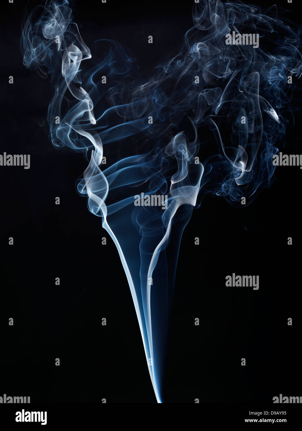 Cigarette and cigar smoke against black background, close up Stock Photo