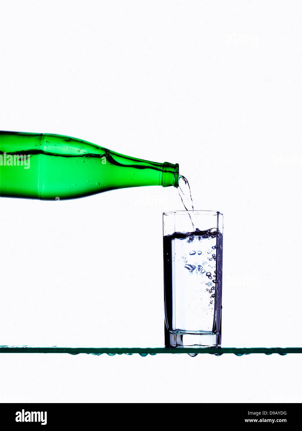 Water being poured into glass from bottle Stock Photo Alamy