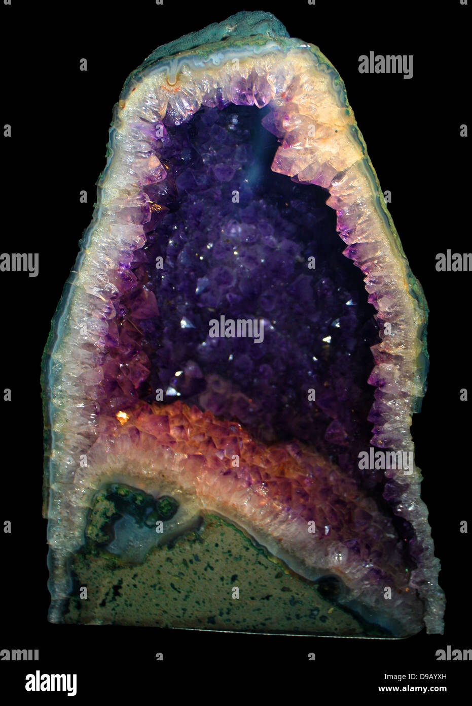 Amethyst. The purple crystals are a variety of the silica mineral quartz.  Here they line a geode, a crystal-lined cavity in ancient lava.  A variety of powers were attributed to amethyst including the ability to cure drunkeness. Stock Photo