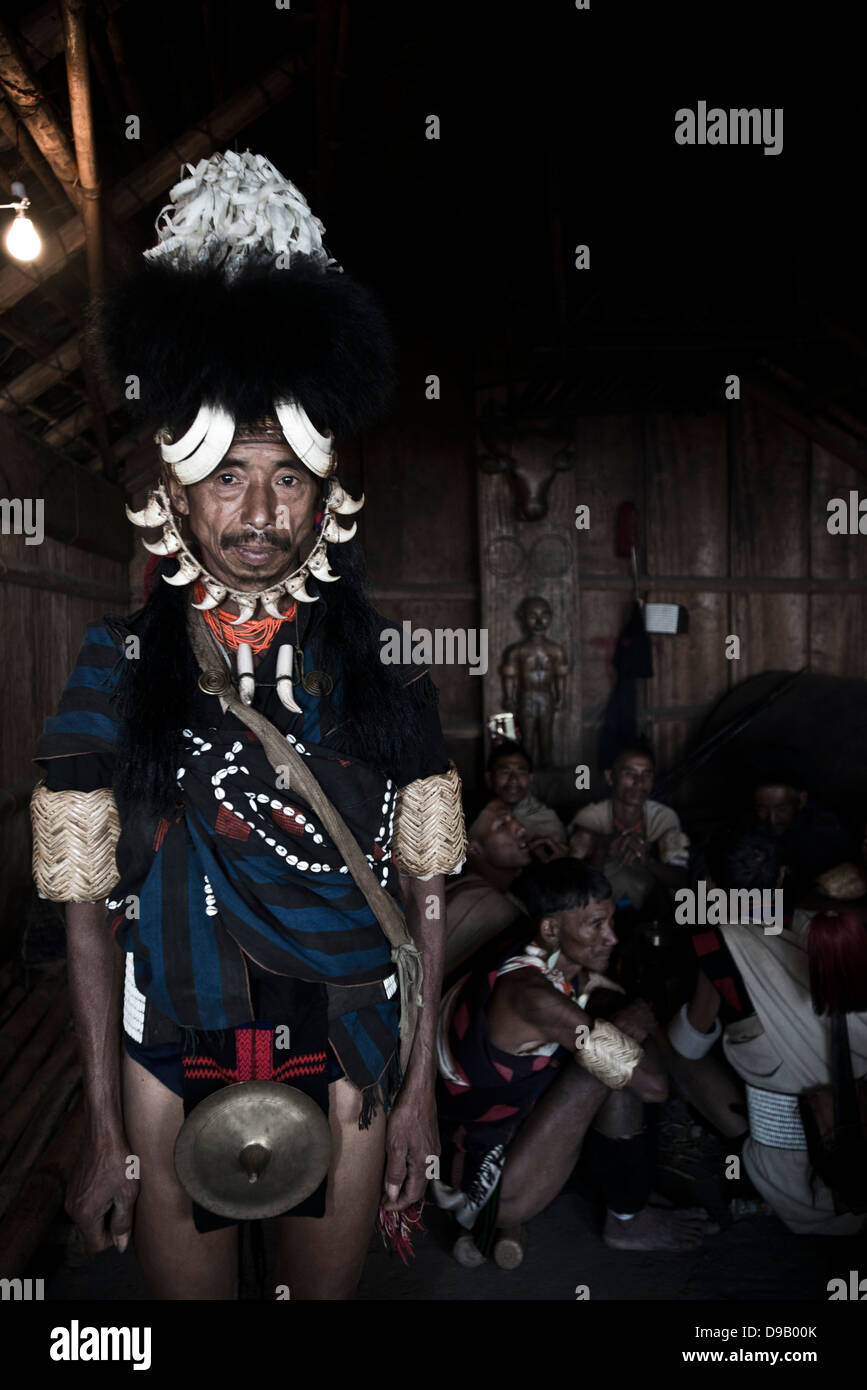 Naga tribal man in traditional outfit in a hut, Hornbill Festival ...