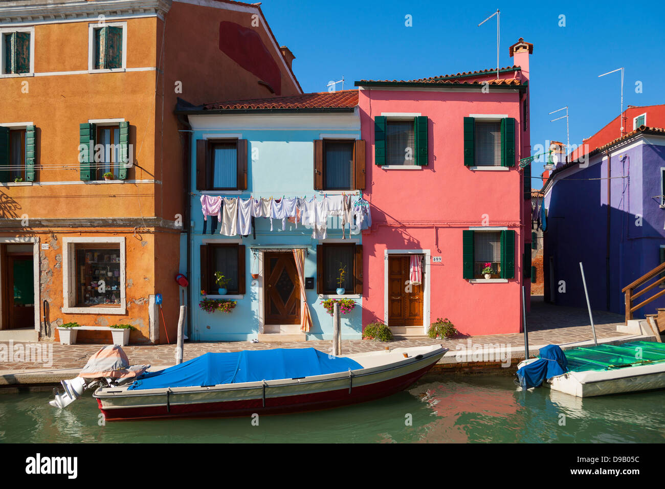 Italy, Venice, Colourful houses and sleepy canal on Burano island Stock ...