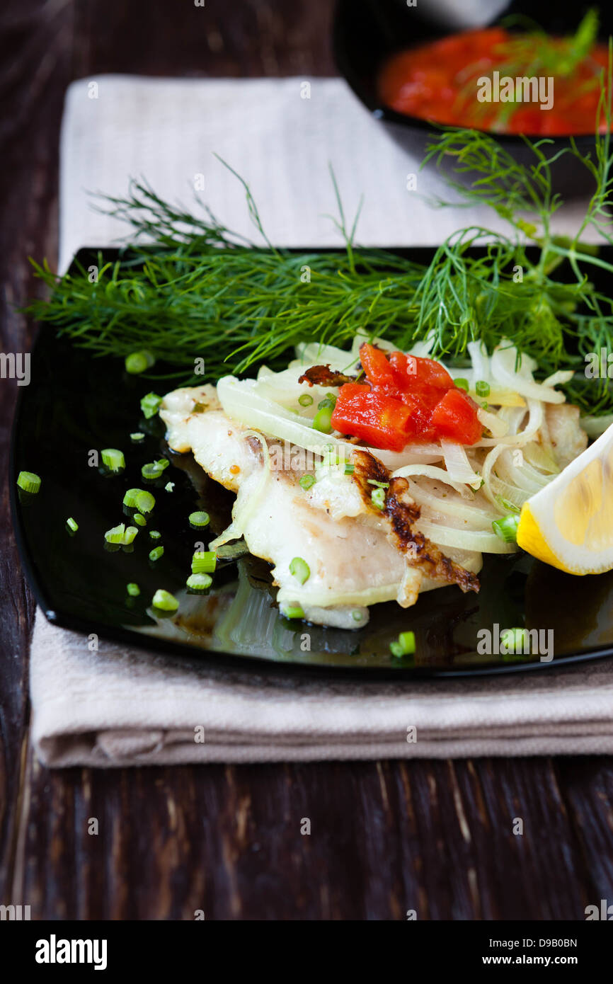 lemon sole fillets roasted with onions, food close up Stock Photo - Alamy