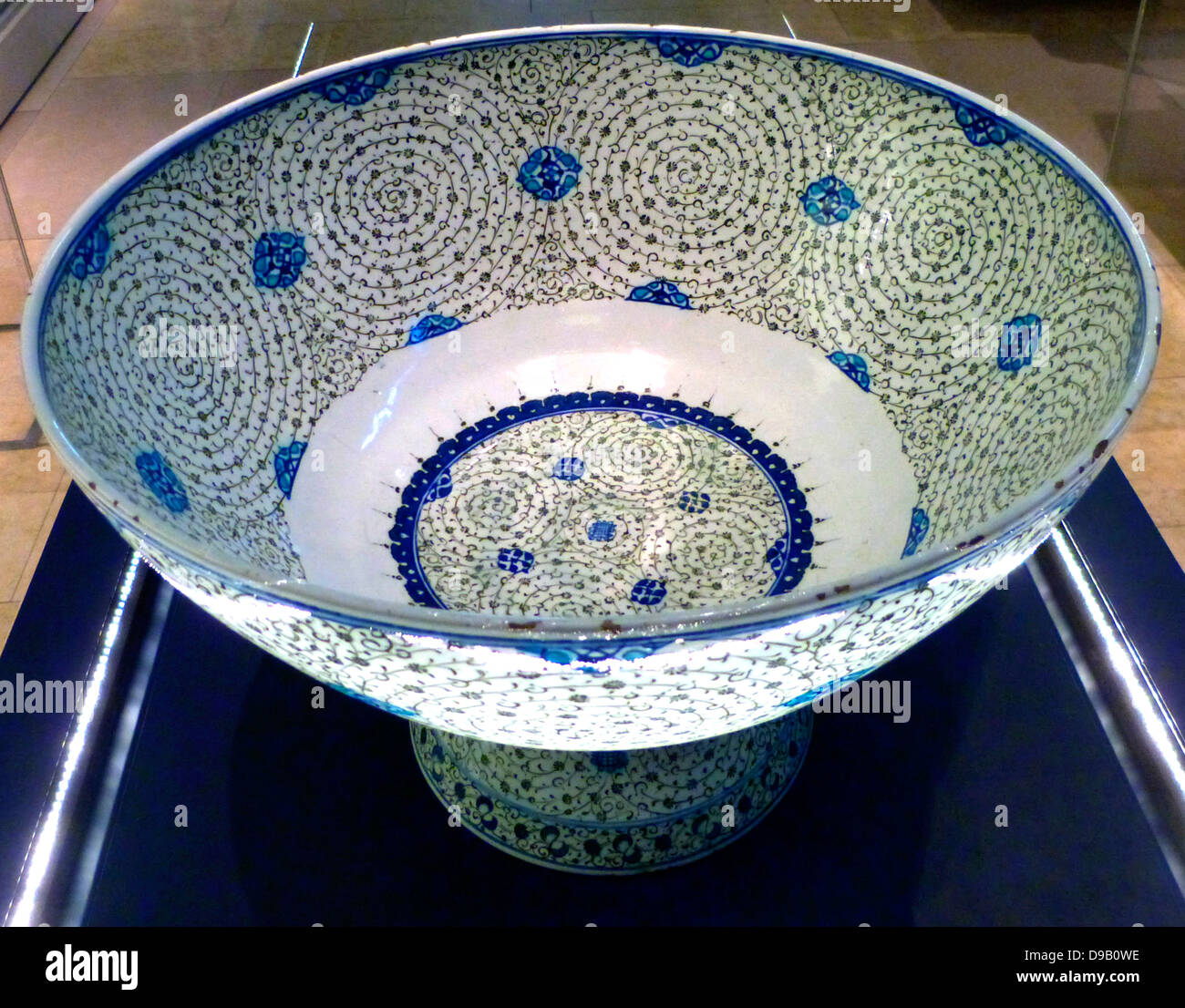 Basin with 'Golden Horn' Design, Turkey, probably Iznik.  About 1545.  This basin is decorated with tight concentric scrolls in black, which bear tiny leaves and flowers.  Design named 'Golden Horn' because examples excavated near the inlet in Istanbul known as the Golden Horn. Stock Photo