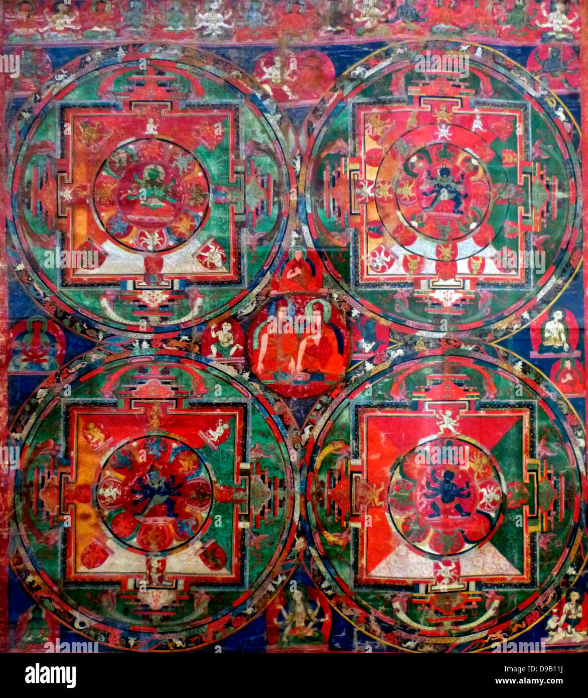Scroll Painting (Thangka) with Four Mandalas 1400-1500.  Each of these four mandalas, or ritual diagrams, represents a sacred space. Stock Photo
