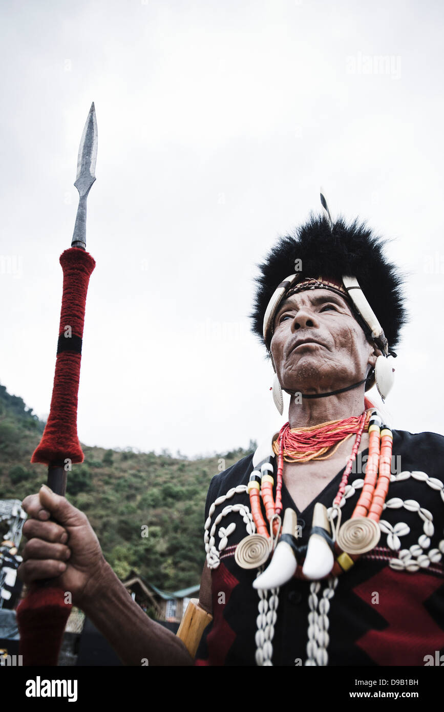 Naga tribal warrior standing with spear, Hornbill Festival, Kohima ...