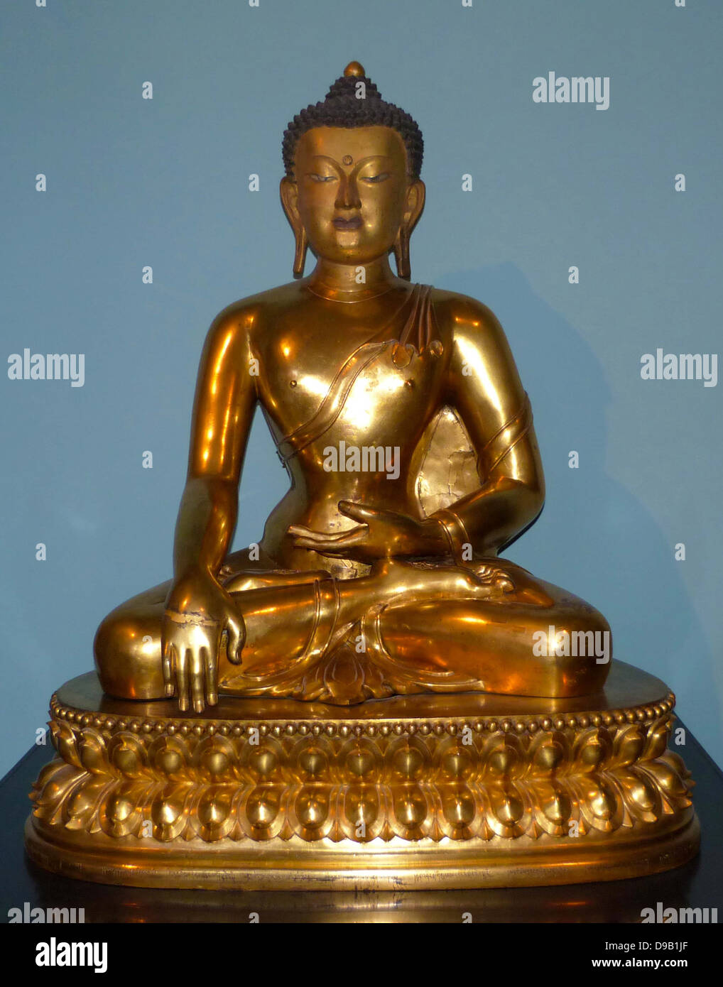 Seated Buddha 174086, China, Gilded copper. The Buddha is shown just