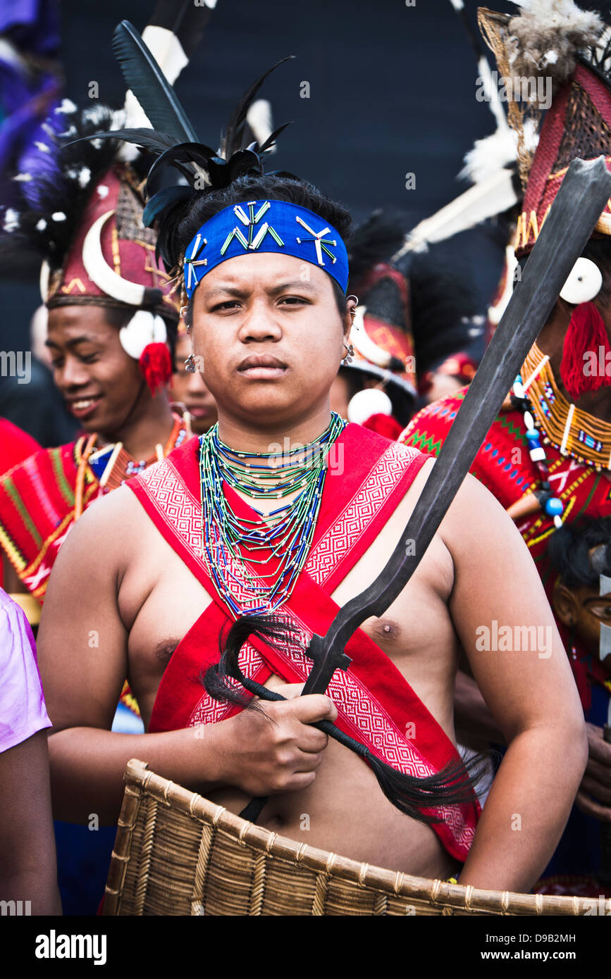 Naga tribesman holding a machete during the annual Hornbill Festival at ...