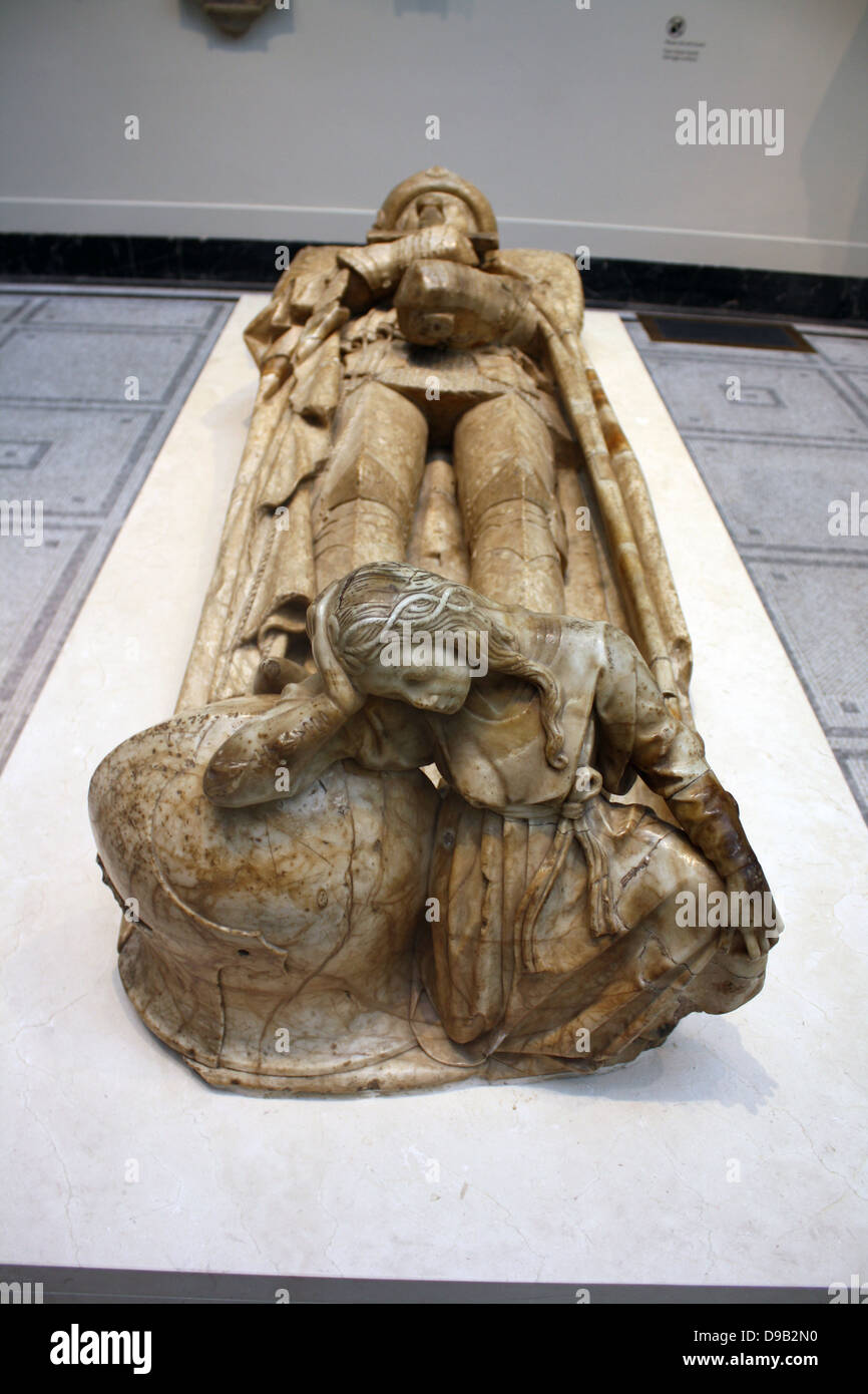 Effigy of Don Garcia De Osorio (1499-1505).  Alabaster, Toledo, Spain. Don Garcia, a knight of the Order of Santiago was buried in the church of San Pedro in Toledo.  Though he wears chain mail and armour, his helmet has been removed and placed at his feet with a symbolic figure of mourning.  His wife's effigy nearly has a similar figure at her feet. Stock Photo