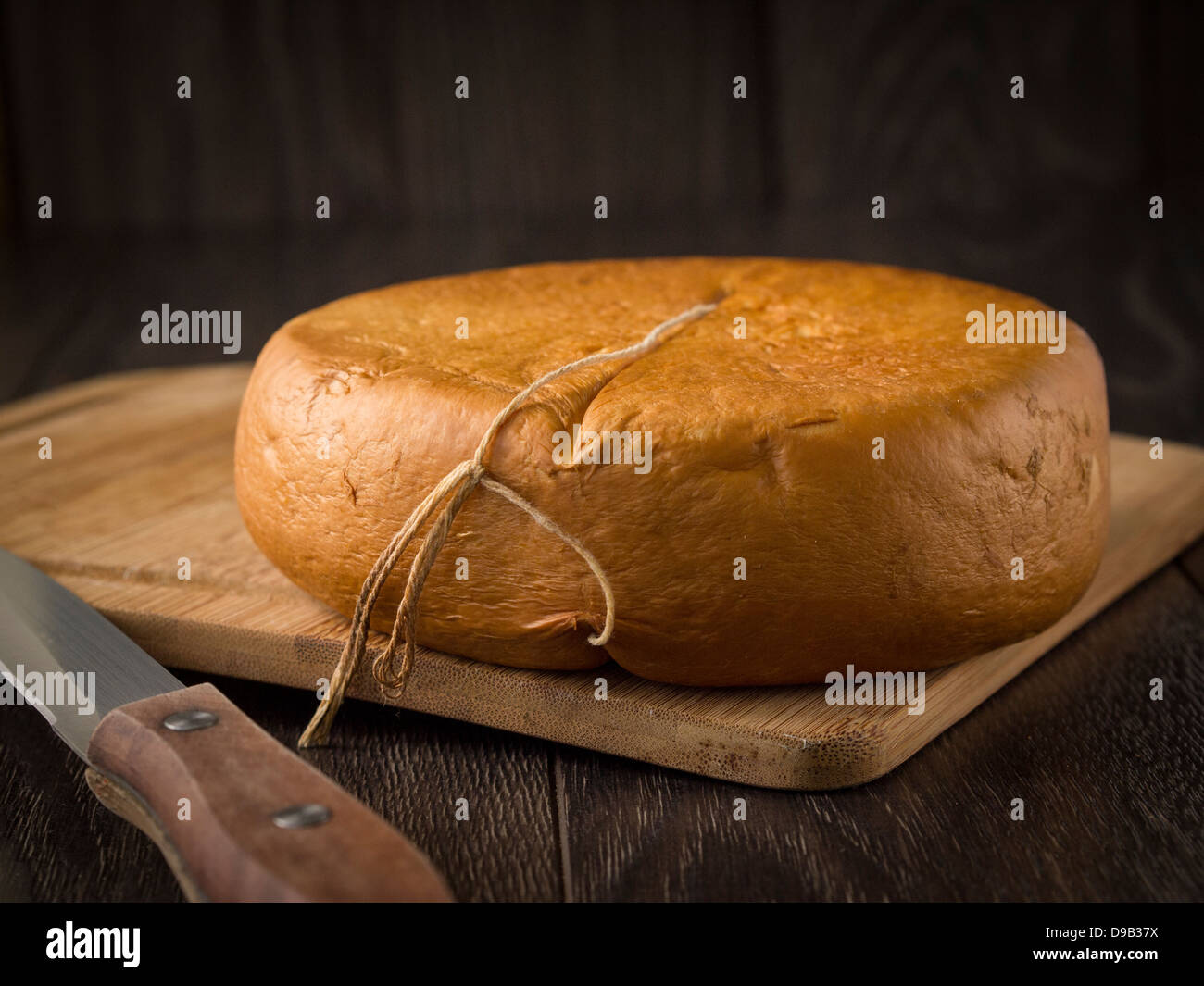 Smoked sulguni - typical Georgian cheese. Stock Photo