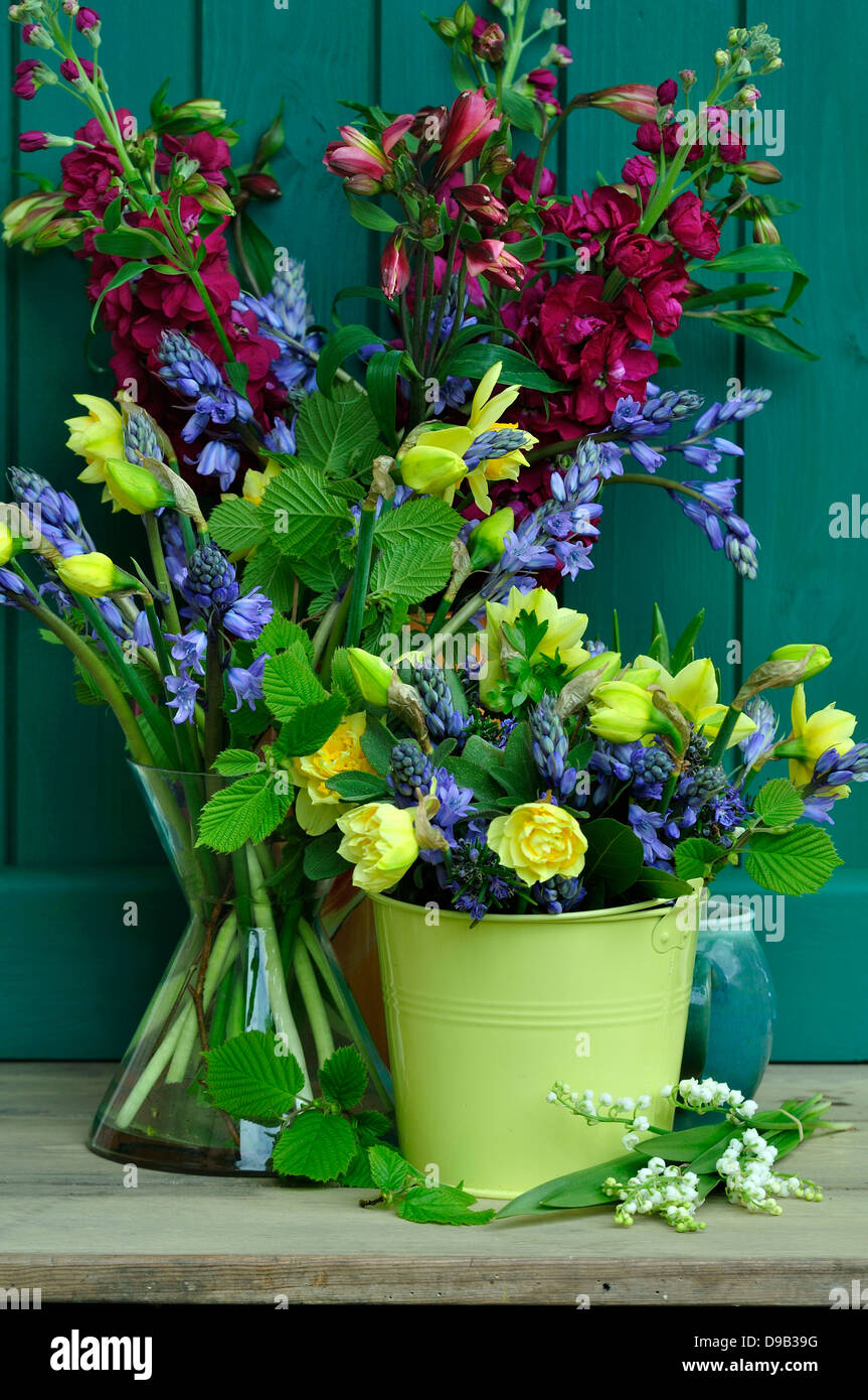 A pretty selection of cut flowers in vases Stock Photo