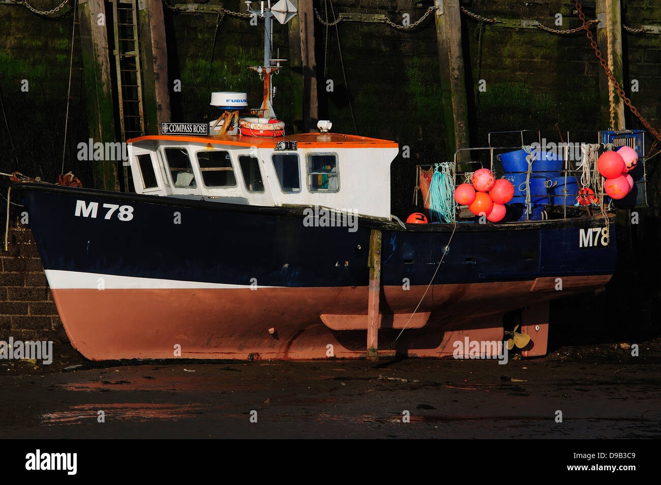 A fishing boat in the harbour at West Bay Dorset UK Stock Photo - Alamy