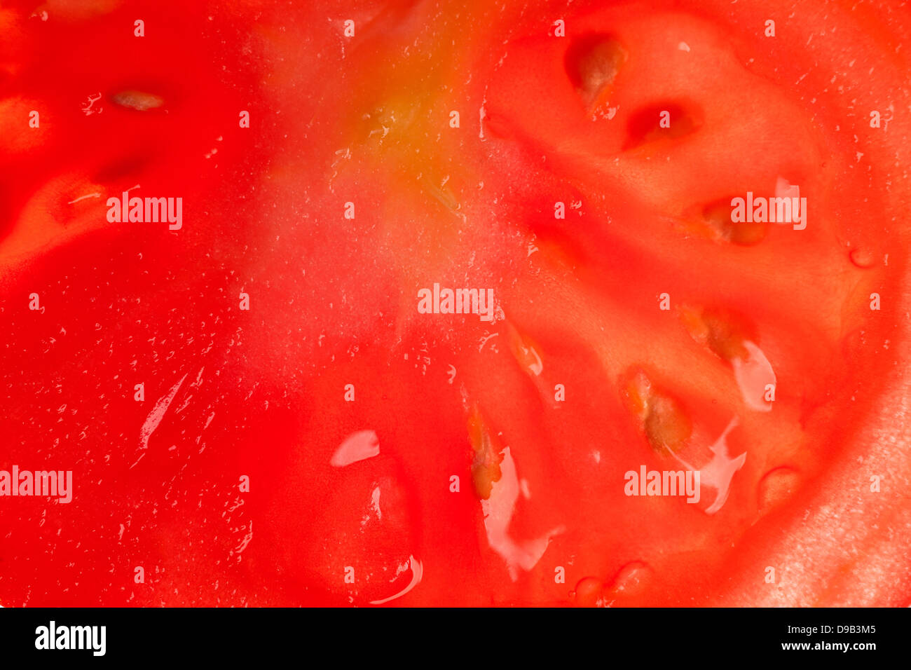 tomato slice background or red organic texture Stock Photo