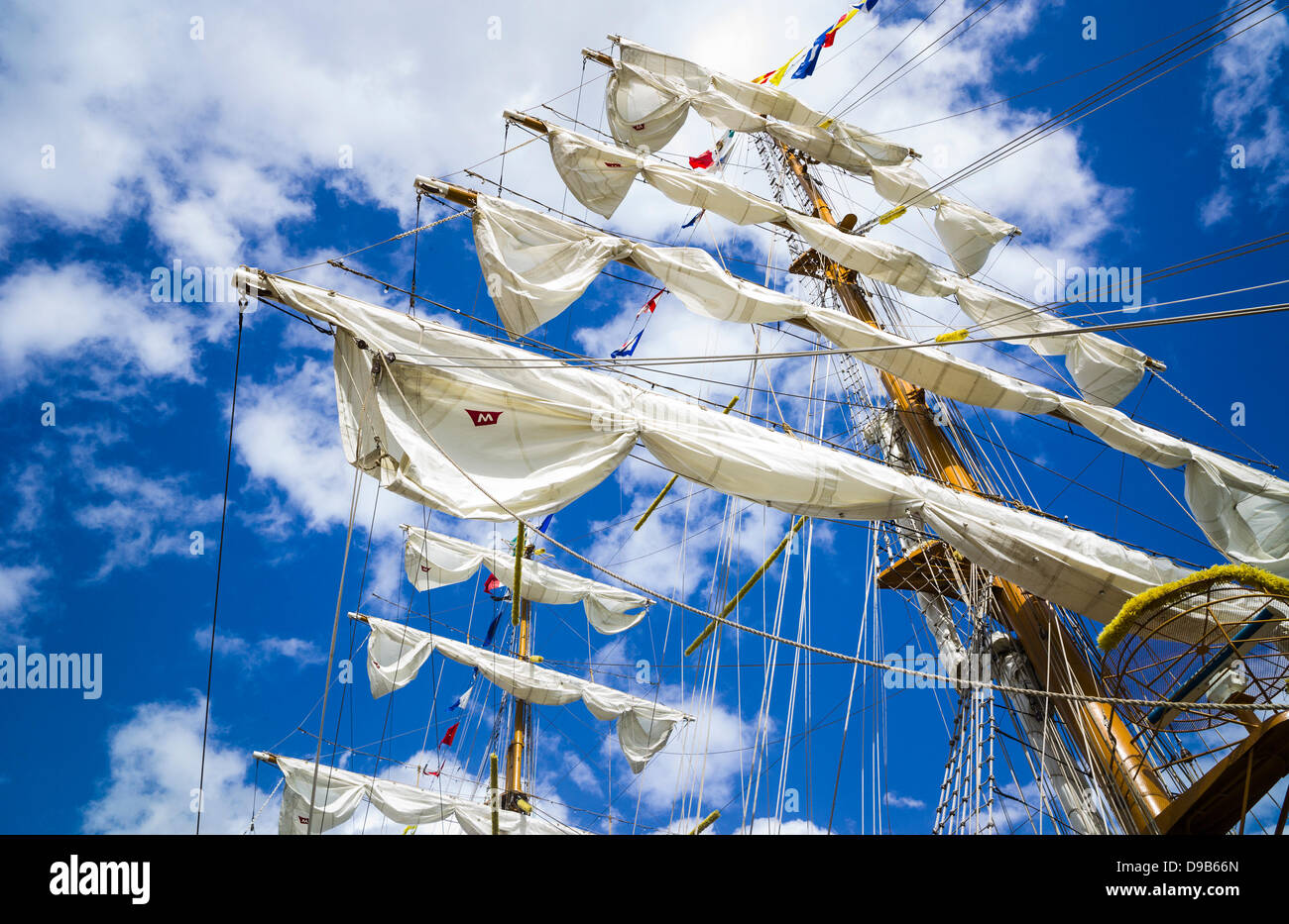 Rouen, France. 15th June 2013. Mexican Naval training ship, Cuauhtemoc at the Rouen Armada. Vivid blue sky with clouds. Horizontal format. Dramatic view of mast and sails. Stock Photo