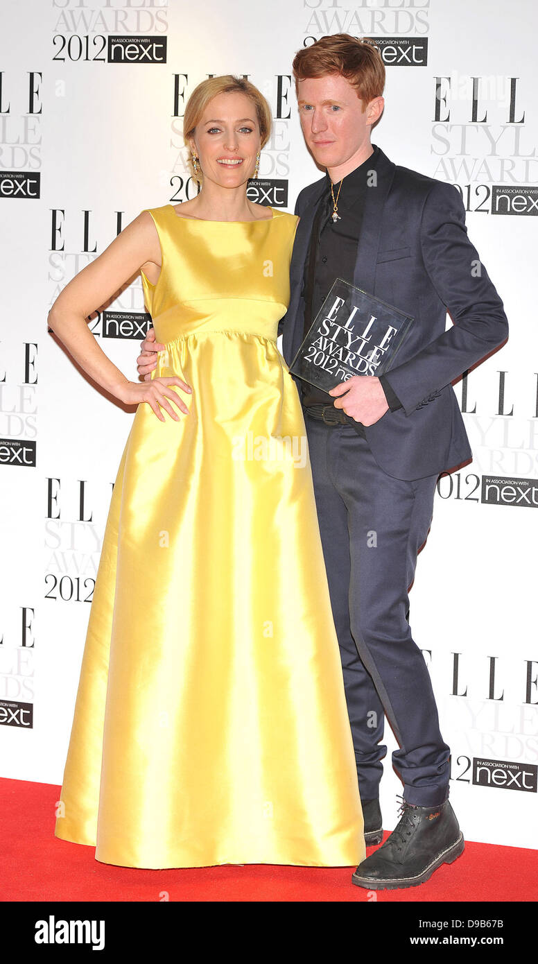 Jordan Askill (R) poses with his 'Jewellery Designer of the Year' award presented by Gillian Anderson (L) ELLE Style Awards held at the Savoy - Press Room. London, England - 13.02.12 Stock Photo
