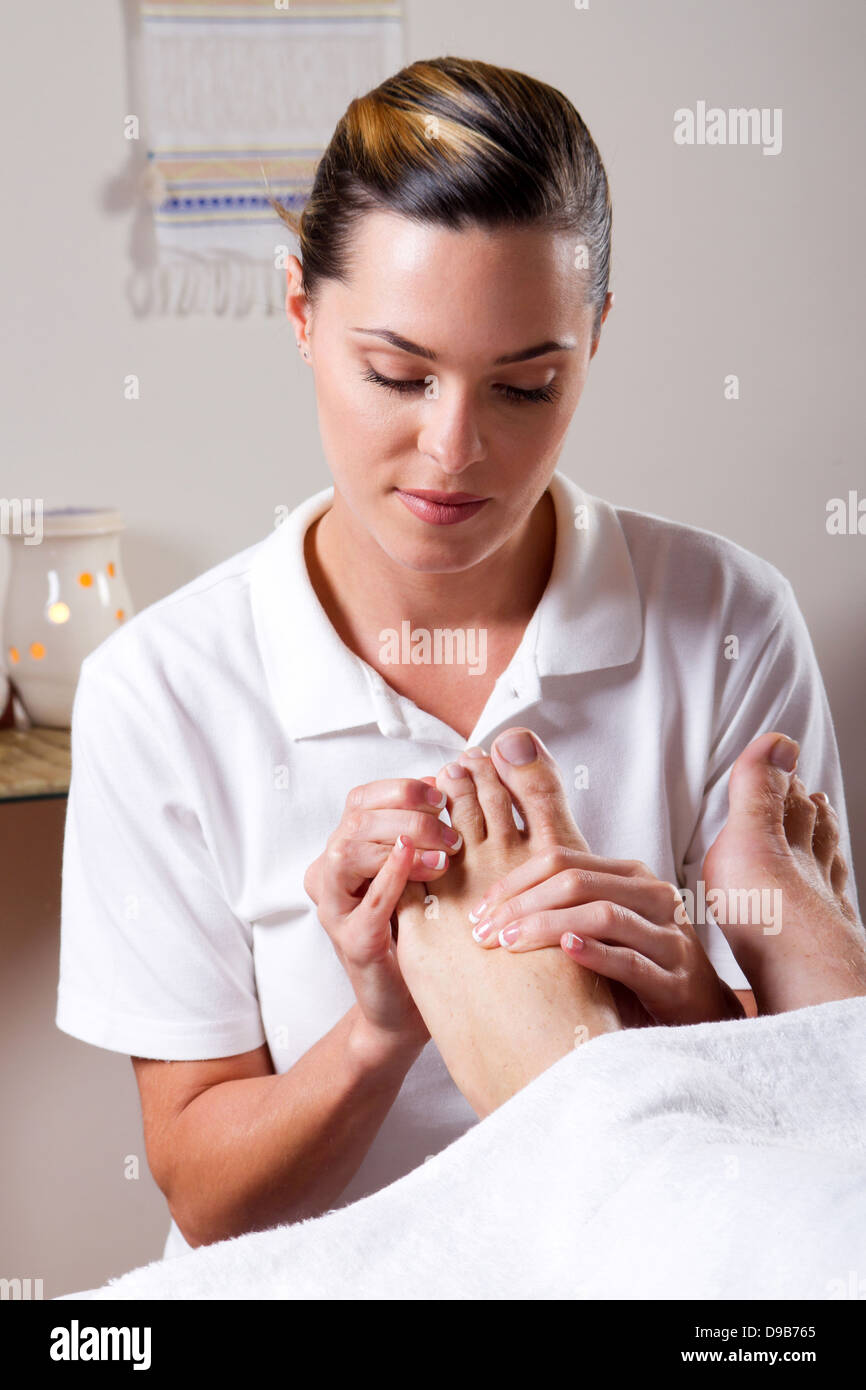 professional masseuse giving foot massage Stock Photo Alamy