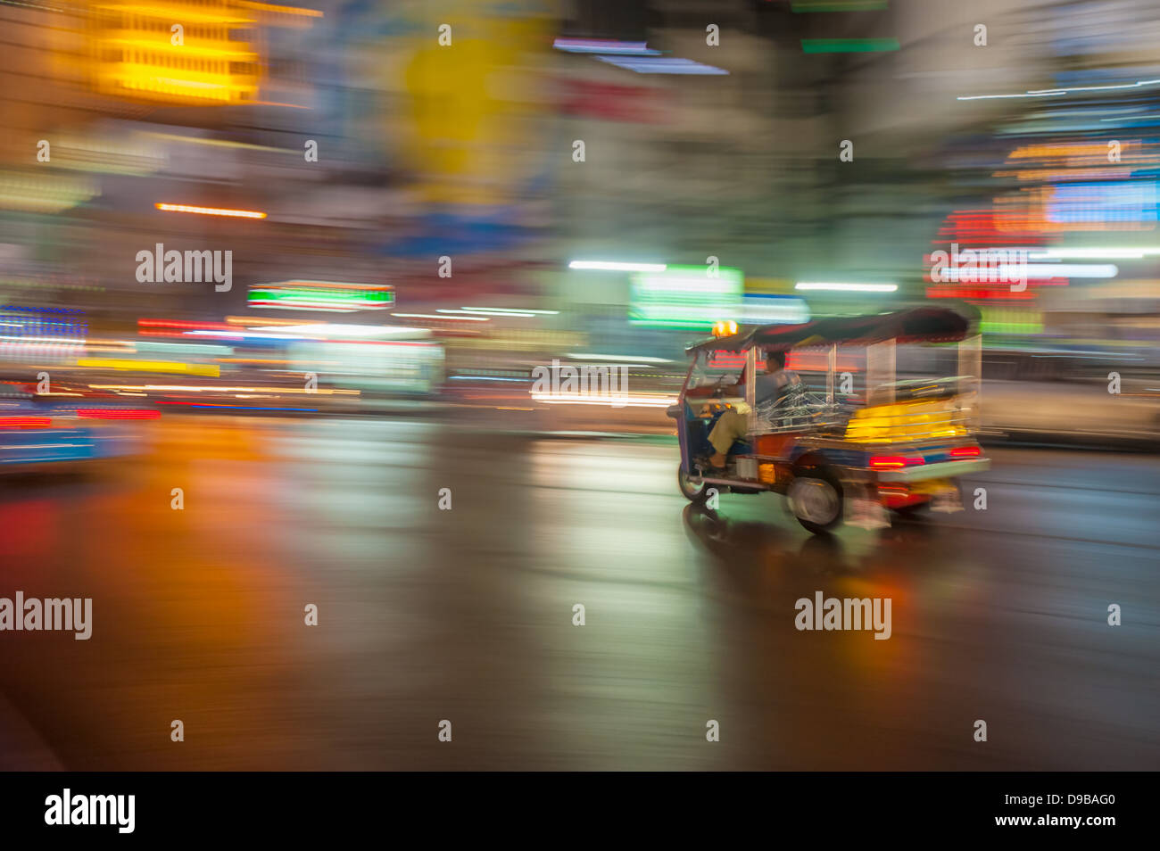Tuk-tuk in motion blur, Bangkok, Thailand Stock Photo