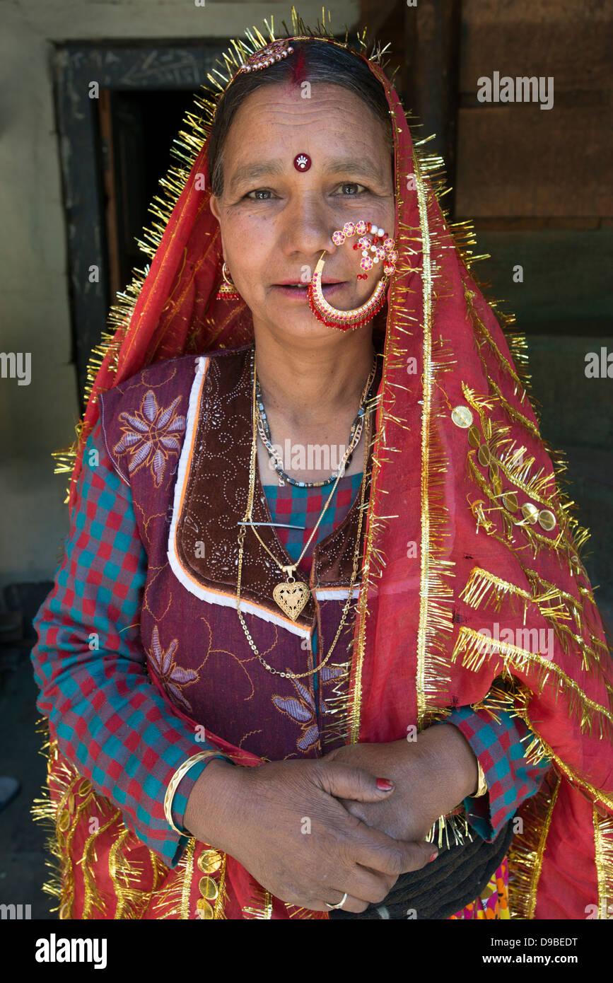 A Gaddi tribal matriarch poses for the camera at the Himalayan village of Kugti in Himachal Pradesh, India Stock Photo