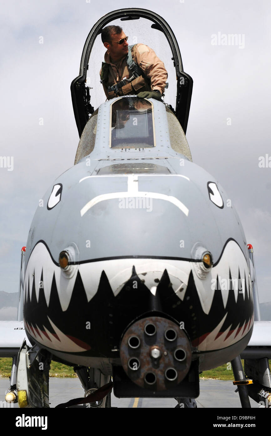 A US Air Force pilot climbs into his A-10 Thunderbolt II before a mission October 2, 2012 at Bagram Airfield, Afghanistan. Stock Photo