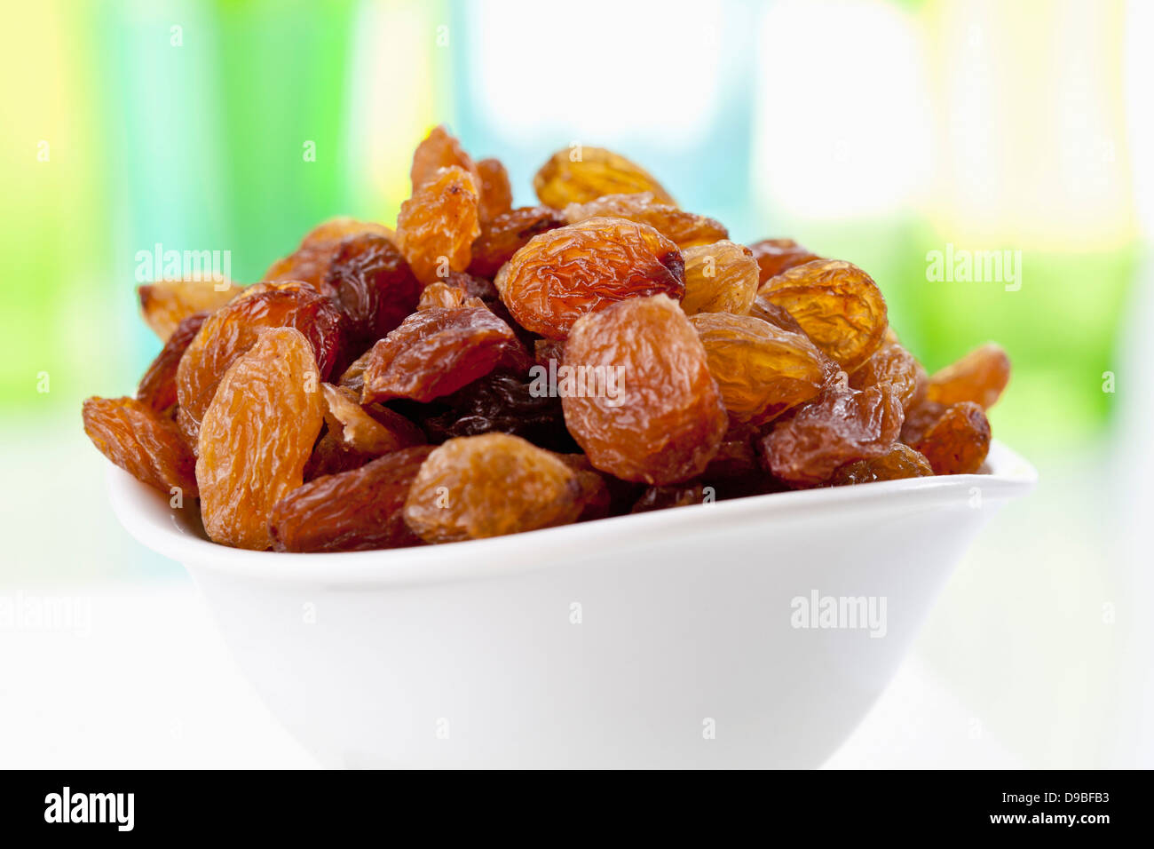 Bowl of sultanas, close up Stock Photo