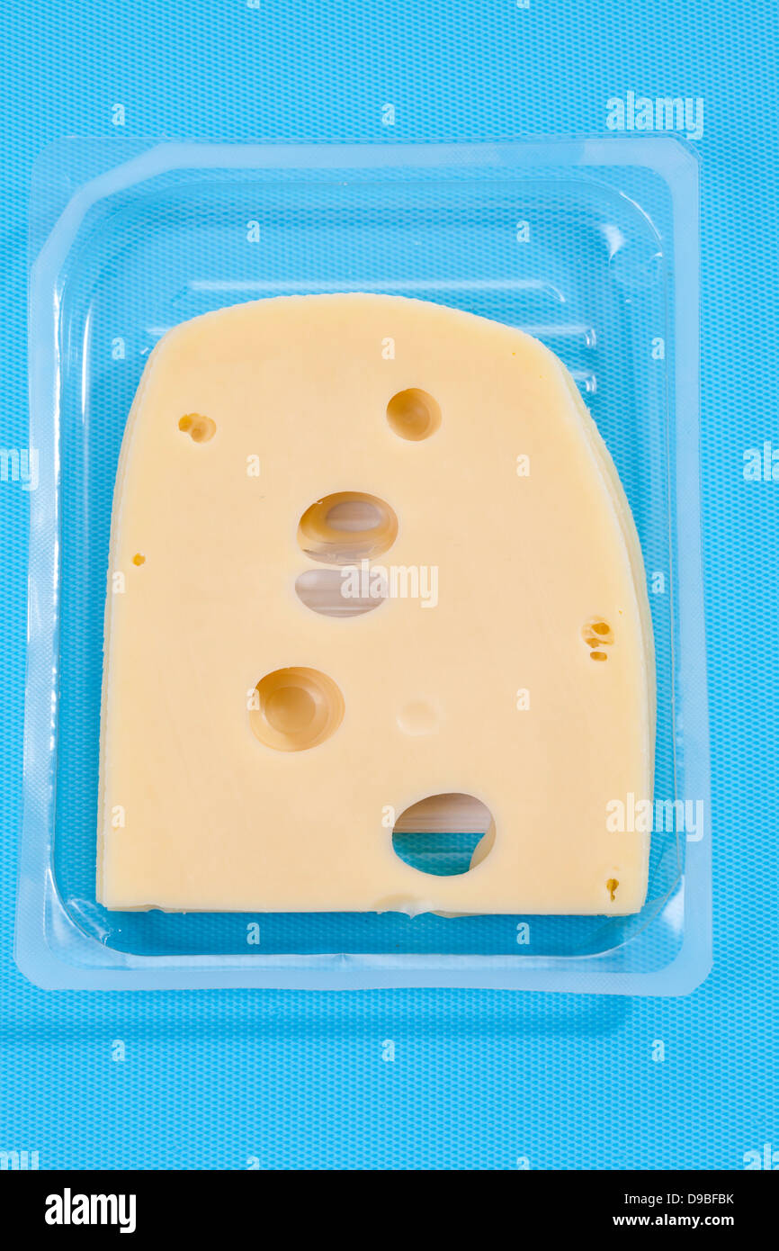 Slice of Leerdammer Cheese in plastic box Stock Photo