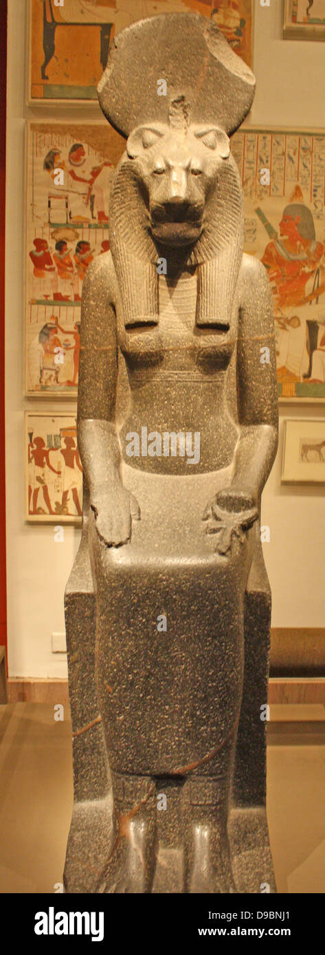 Statue of the Goddess Sekhmet, New Kingdom, Dynasty 18, 1390-1152 B.C.  Sakhmet represented the forces of violence, unexpected disaster and illness.  She had the head of a lioness and the disk identifies her as the daughter of the sun god. Stock Photo