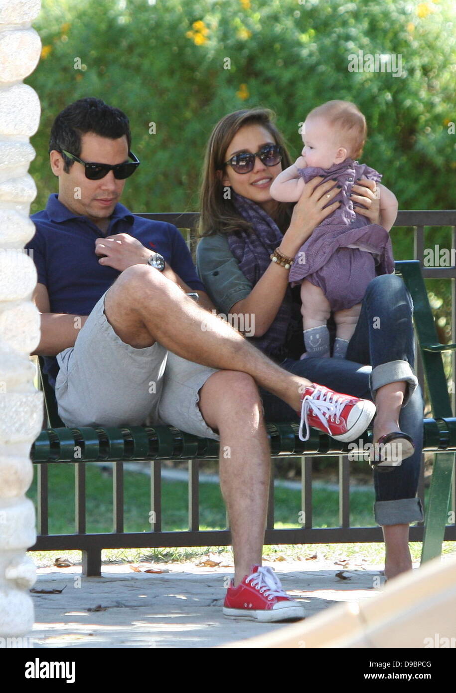 Jessica Alba and Cash Warren sit on a bench with Haven Warren during a