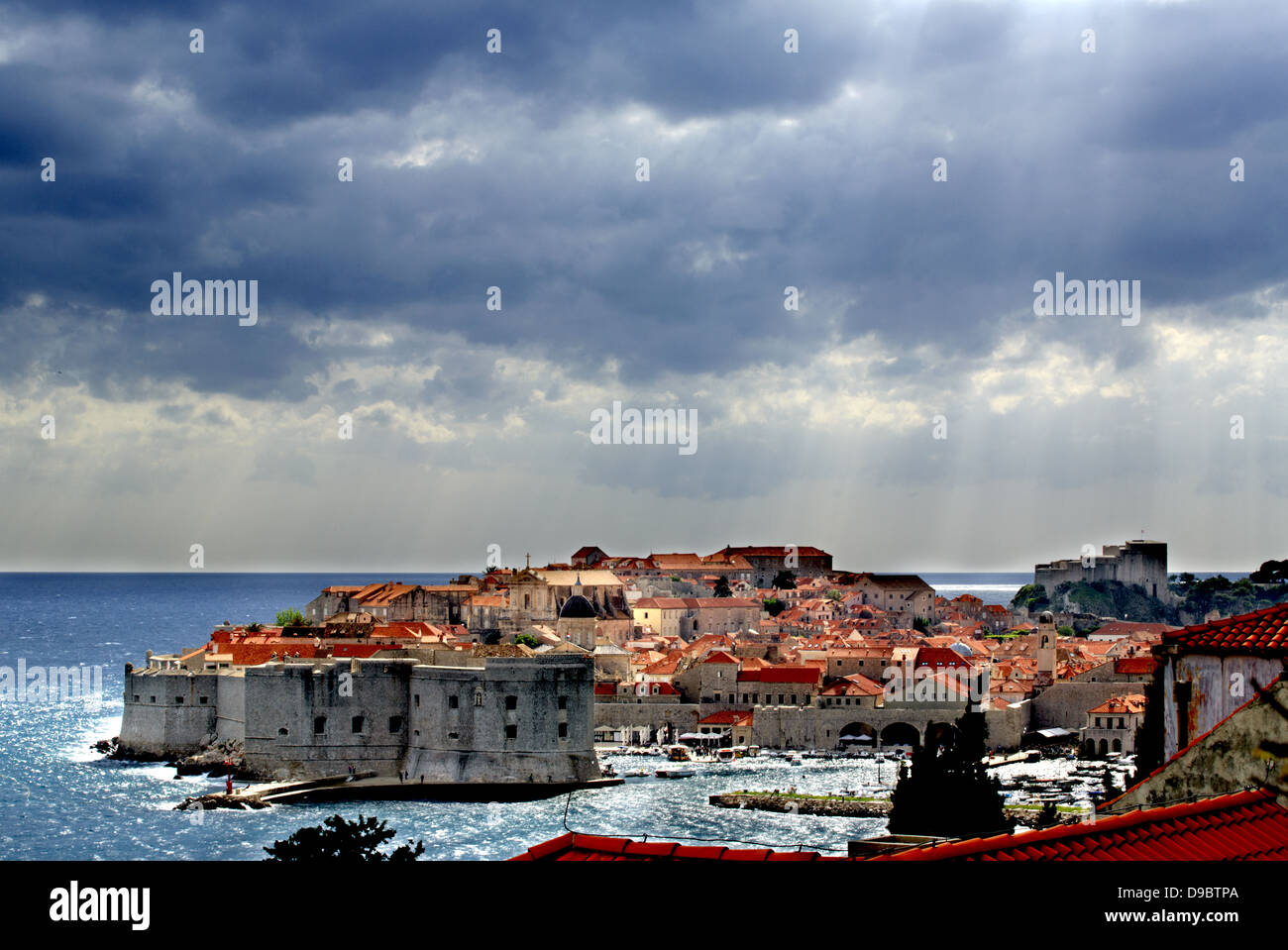 Stormy Dubrovnik with rays of sunshine glistening on the sea Stock Photo
