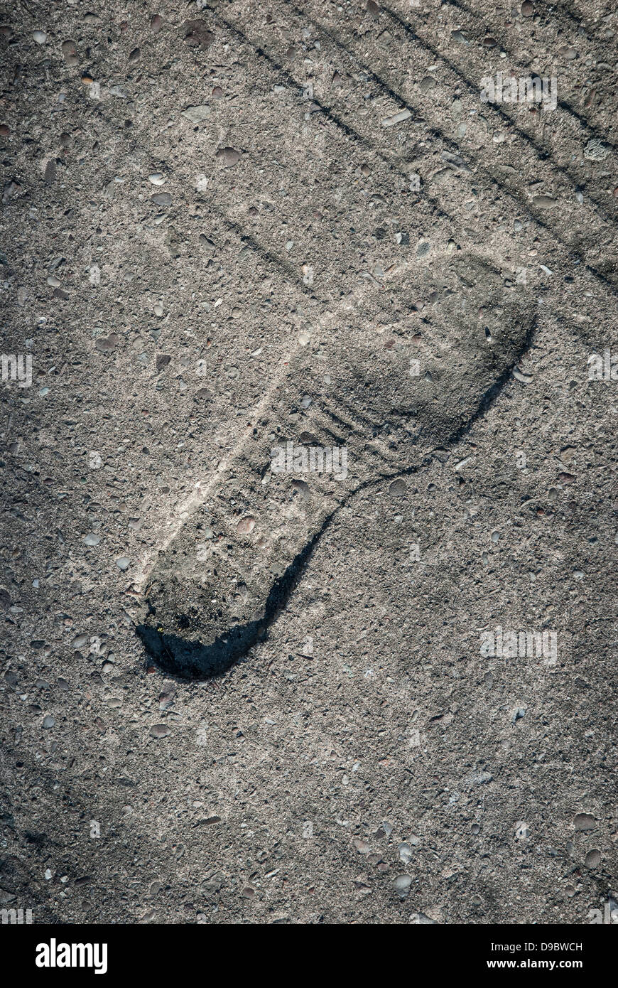 Footprint impression in concrete floor Stock Photo Alamy