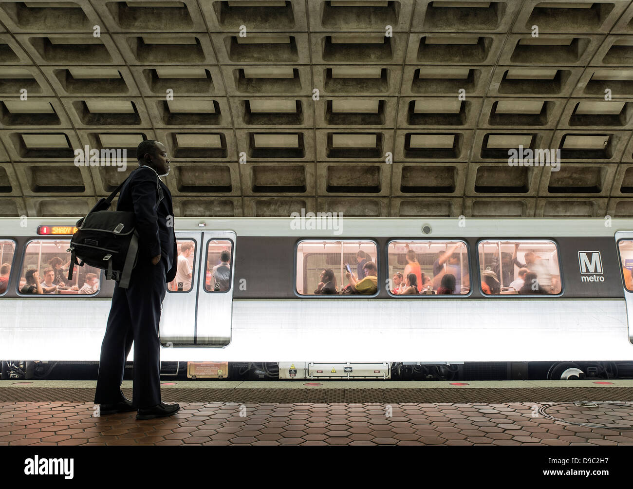 Commuter waits for metro, Washington DC, USA Stock Photo