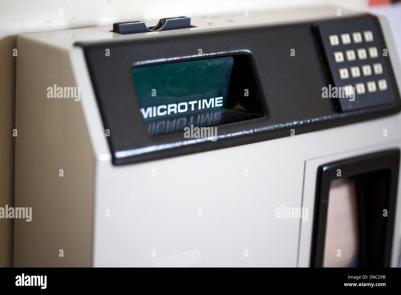 Microtime Office clocking on machine Stock Photo