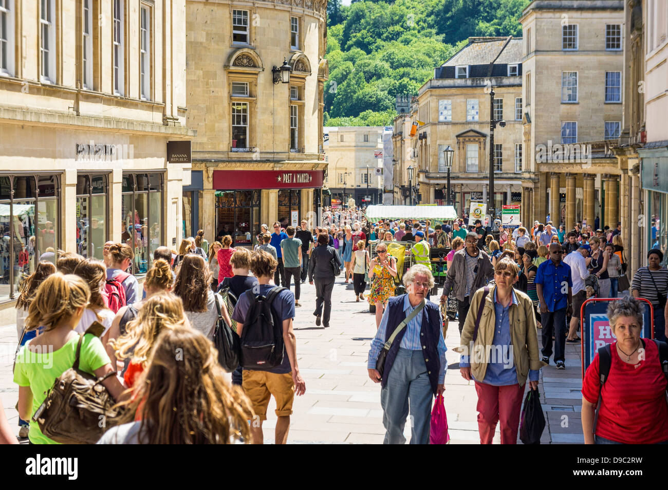 High street UK - shoppers shopping in Bath city centre main street, Bath, England, UK Stock Photo