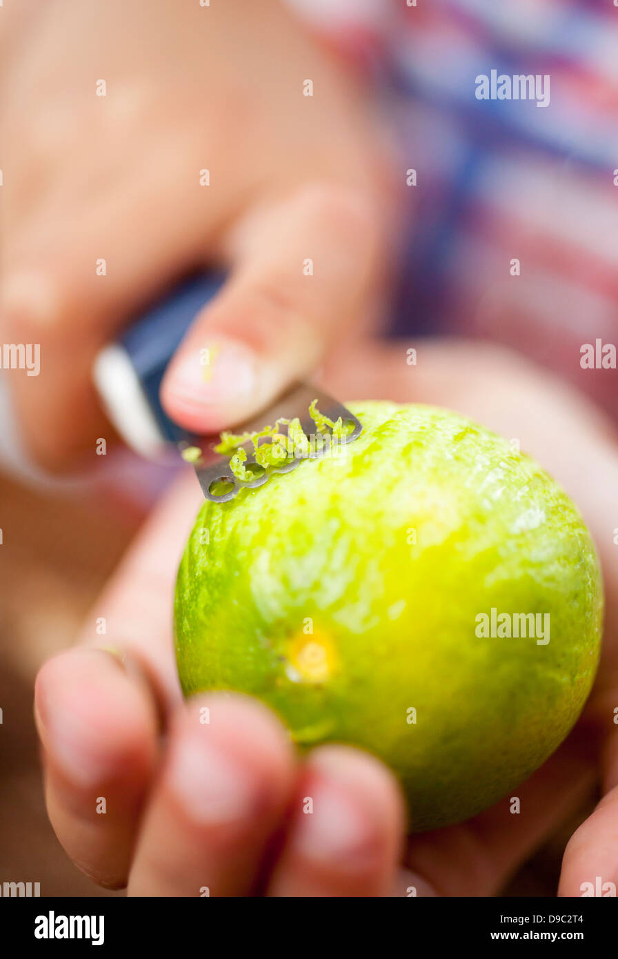 zesting a lime Stock Photo Alamy