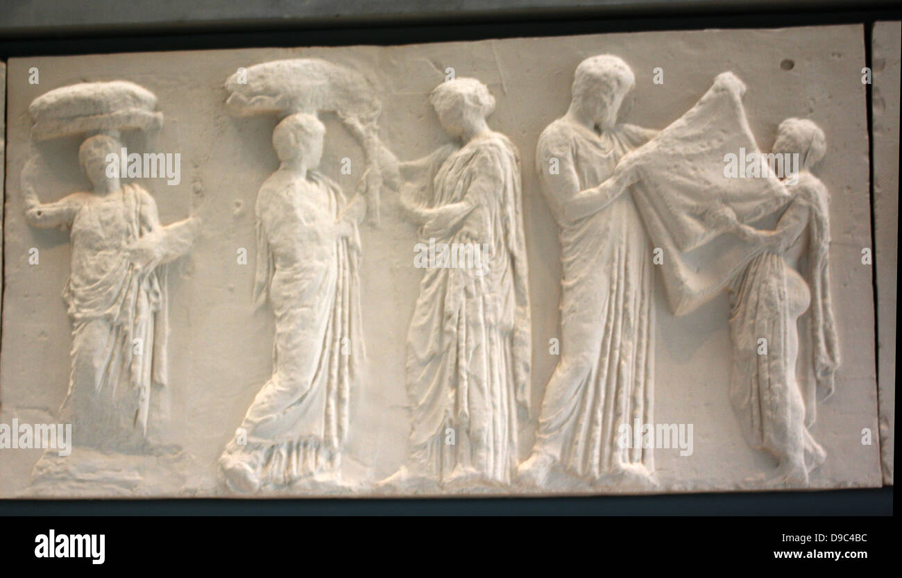 A young winged goddess, Iris or Hebe, messenger of the diving couple Zeus and Hera, stands next to Hera turning toward the procession, while she arranges her wind blown hair with her left hand. Hera turning towards Zeus holds the edges of her himation, which covers her head in the gesture of a bride revealing herself to her husband. Stock Photo