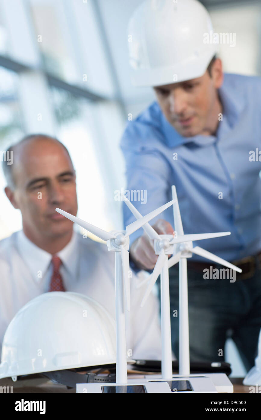 Engineers with model wind turbines Stock Photo Alamy