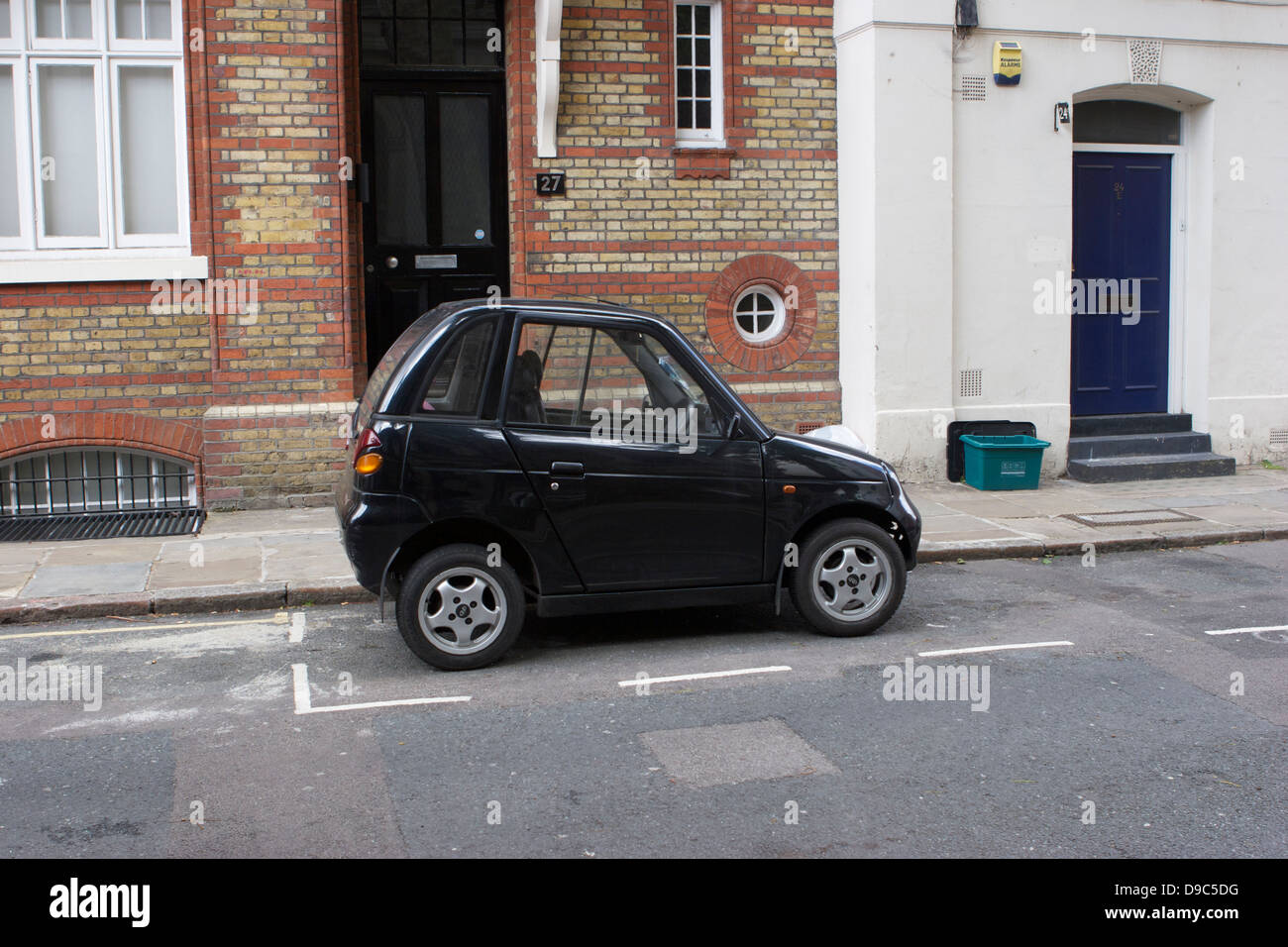 Reva G-Wiz parked in a street in London Stock Photo