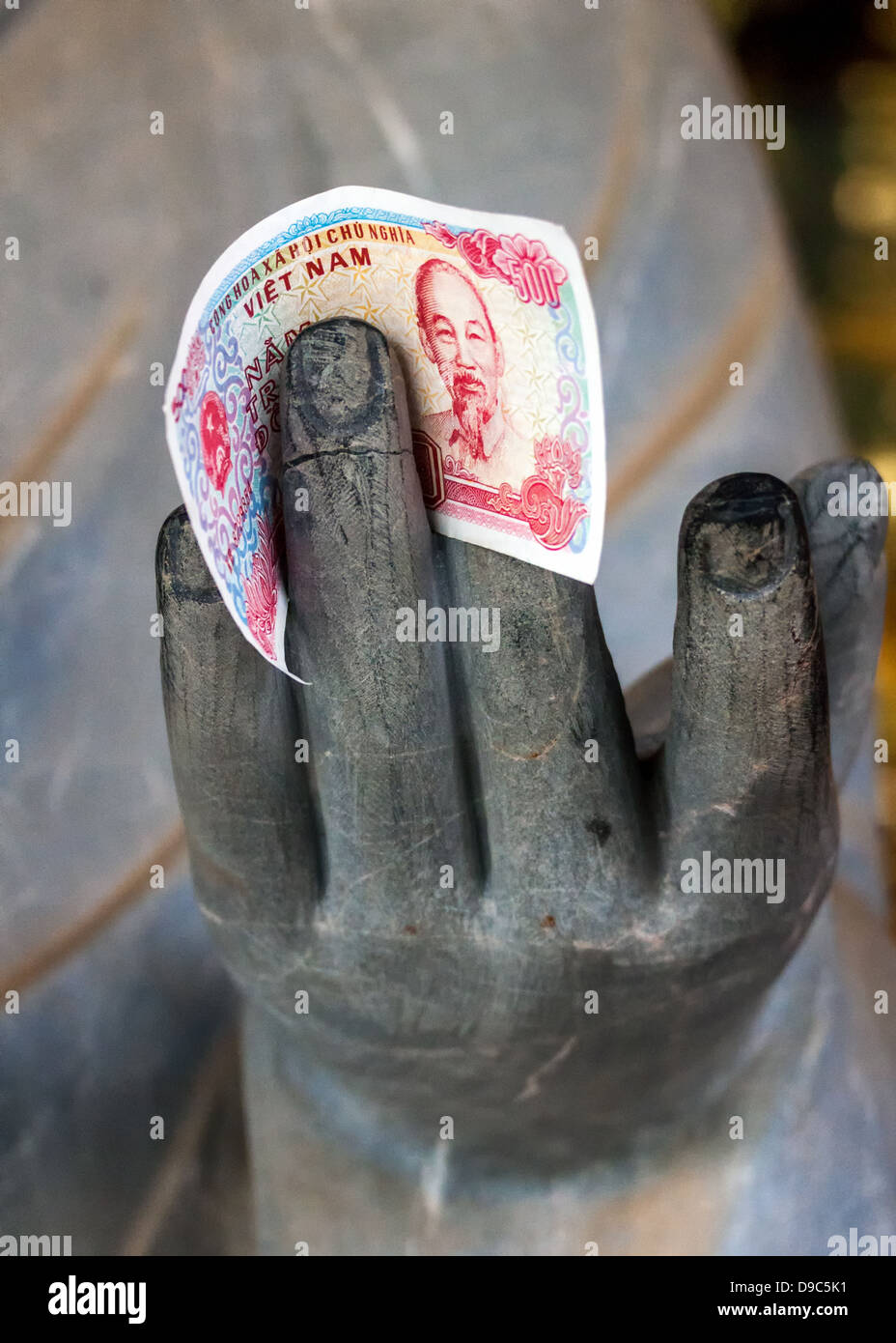 Vietnam Chua Bai Dinh Pagoda: Close up of Buddhist Philosopher's hand with money between fingers. Stock Photo