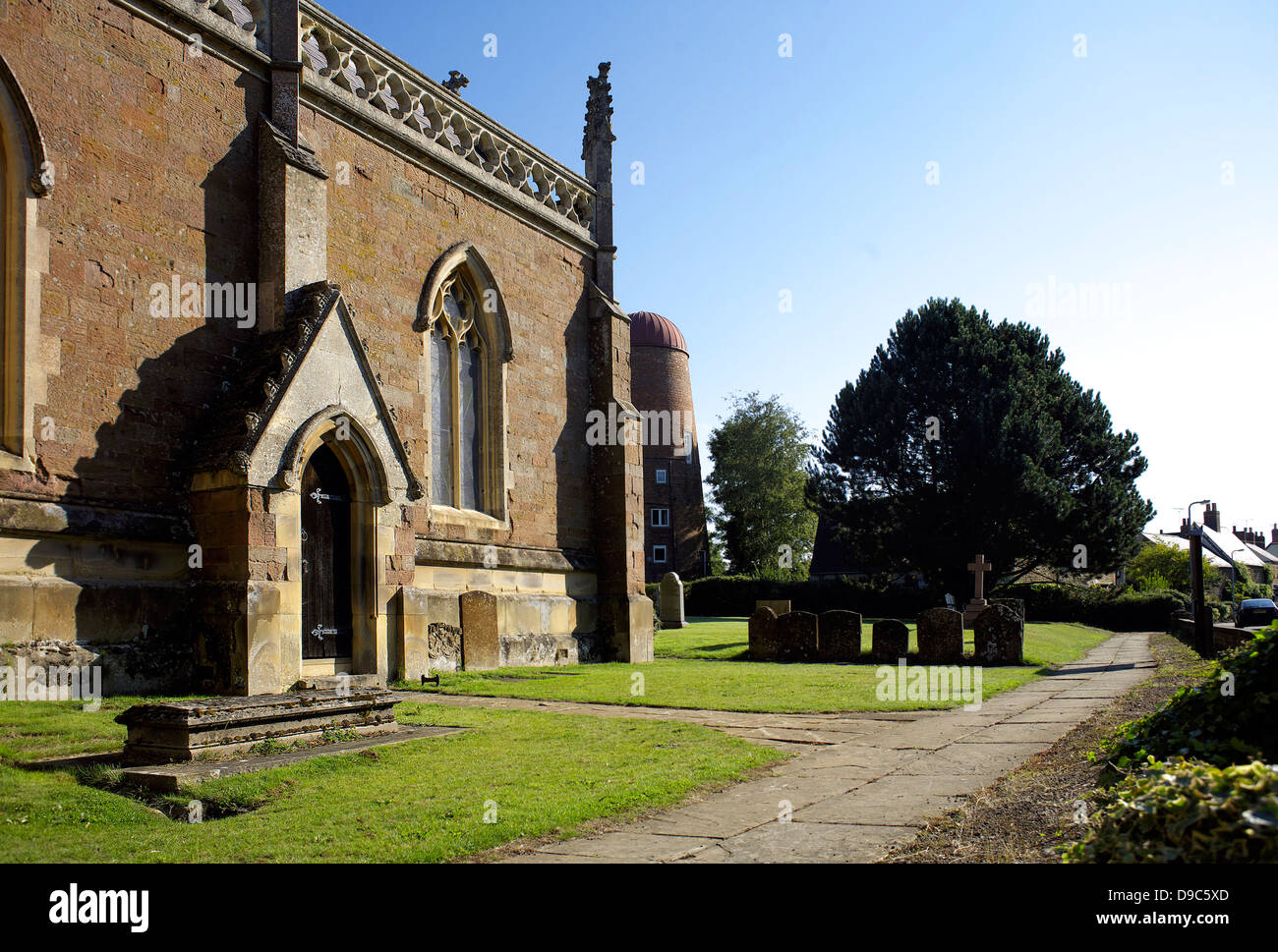 All Saints' Church and windmill, Braunston village, Northamptonshire, Northants, England, UK,GB,rural England, country life, Stock Photo