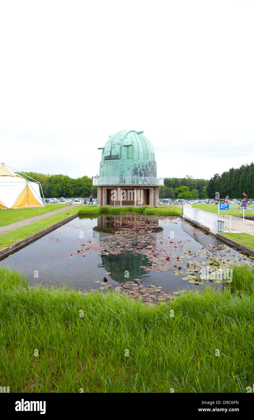 Observatory dome across pond / water feature with planting Stock Photo