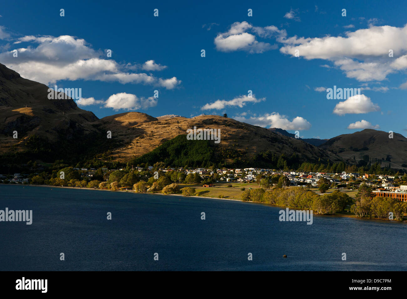 View of hills surrounding Lake Wakatipu, near Queenstown, Otago District, South Island, New Zealand Stock Photo