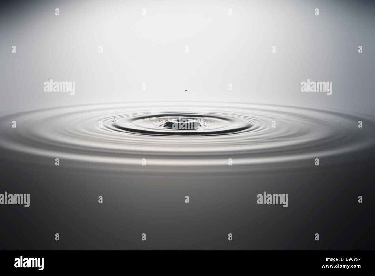 Water droplet falling into water Stock Photo Alamy