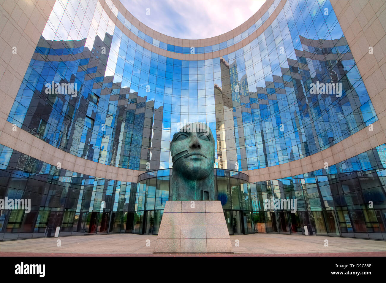 An HDR image of statue in the front of office building at La Defense in Paris, France. Architecture and city image. Stock Photo