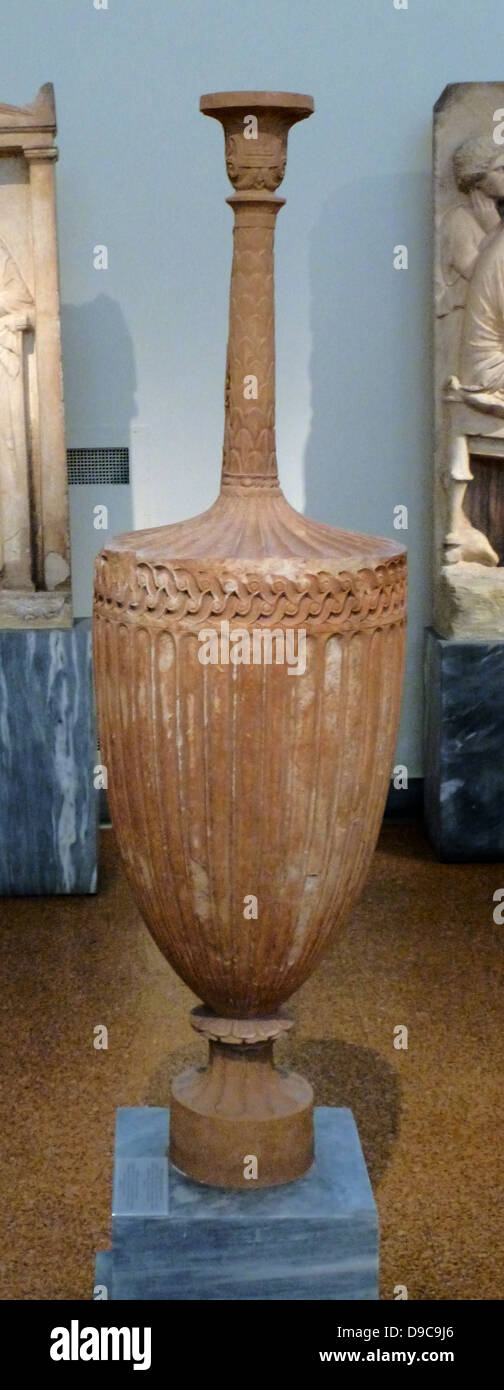 Funerary Lakythos, Pentelic marble, confiscated in Athens.  The neck, mouth, handle and base are restored.  The largest part of the vase is decorated with relief floral motifs and the neck with a scale pattern.  350-325 BC Stock Photo