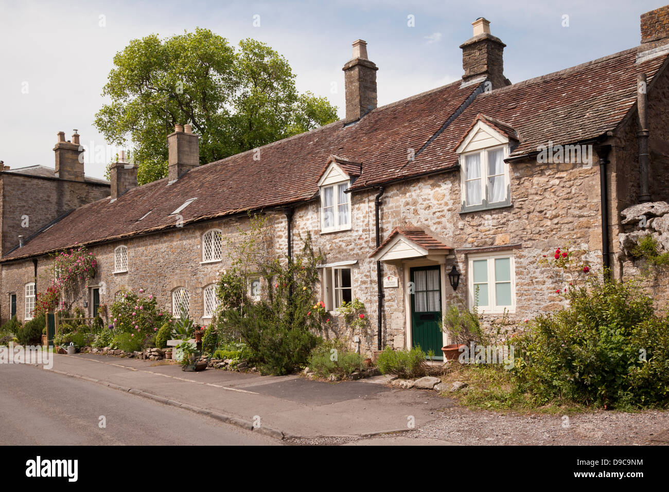 Row of stone terraced houses in the village of Mells, Someret, UK Stock