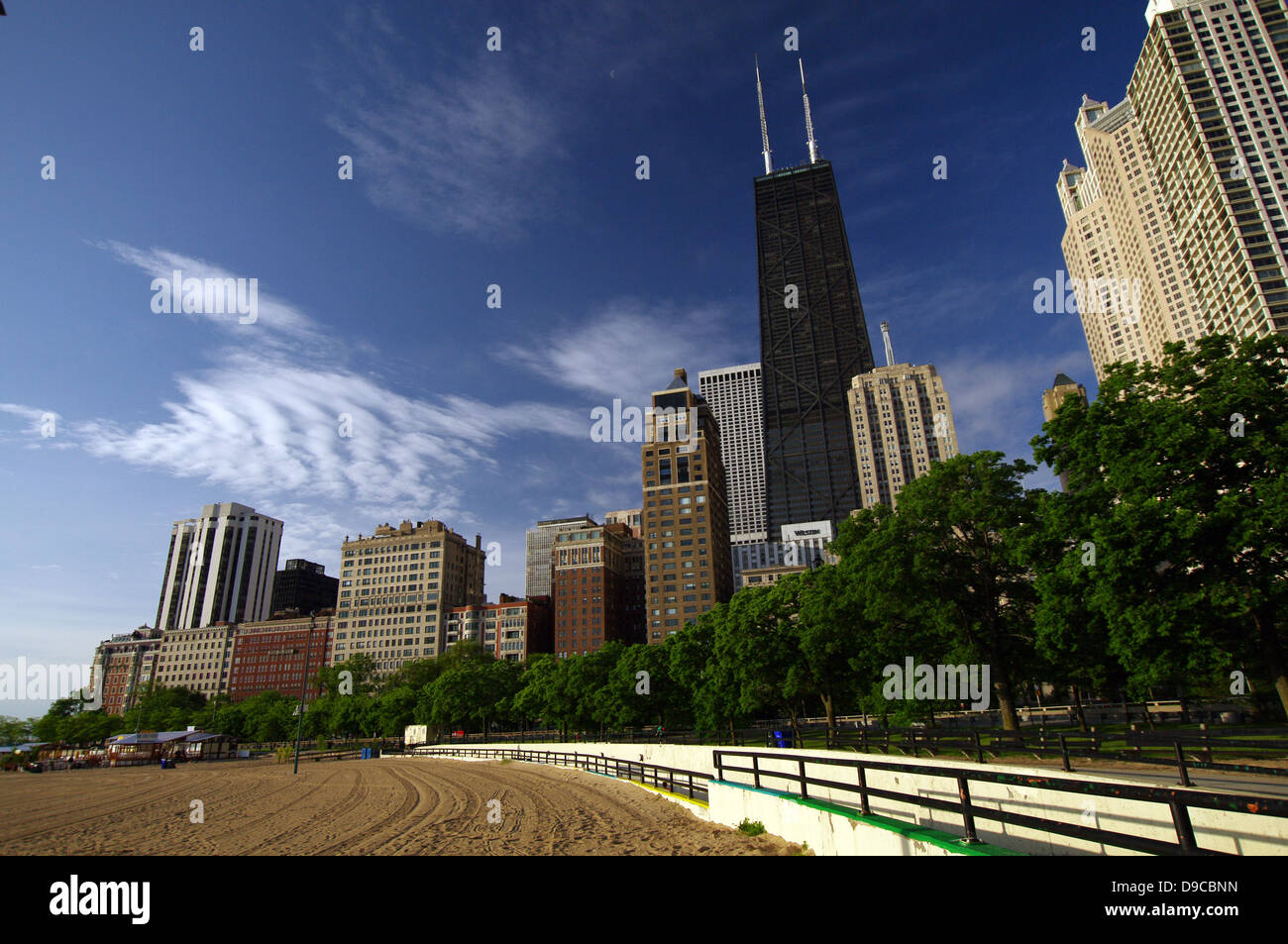 Oak Street Beach and the Chicago Lakefront Trail with John Hancock Center in the background - Chicago, USA Stock Photo
