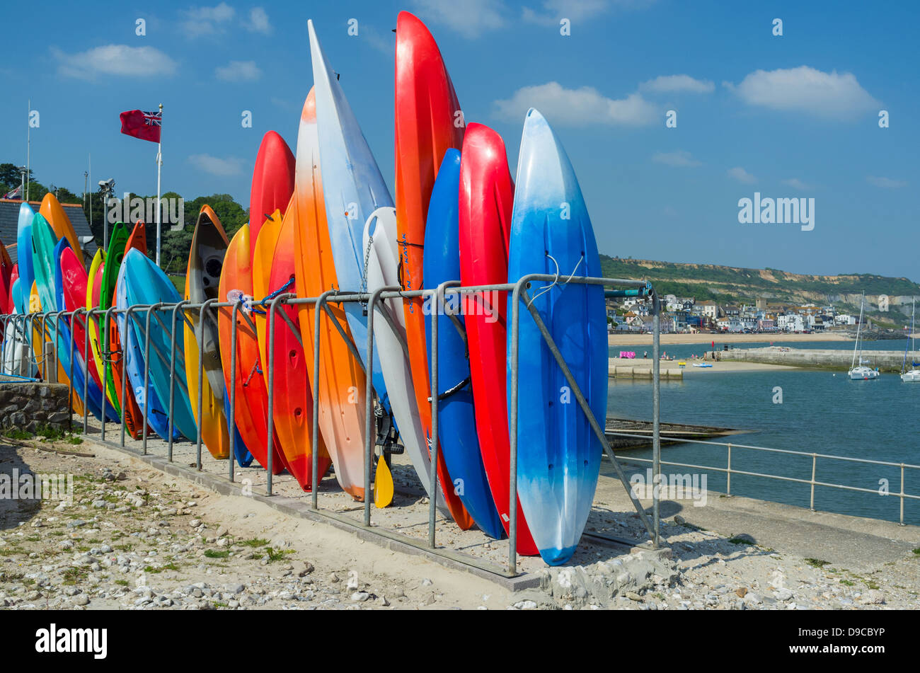 Lyme Regis, Dorset, England. June 6th 2013. Kayaks stacked up ready for