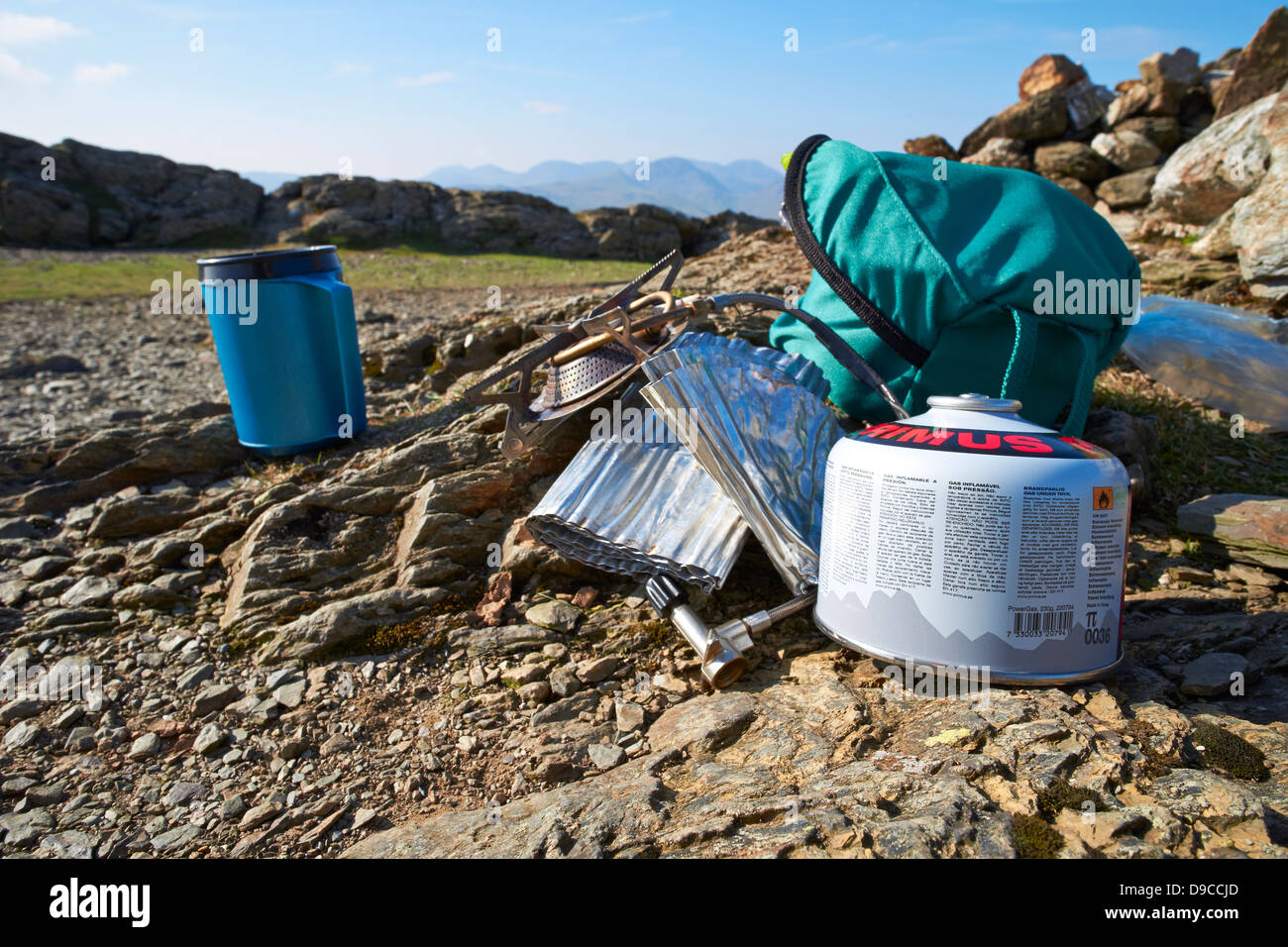 Camping stove, gas and pans on the summit of a Robinson in the Lake District. Stock Photo
