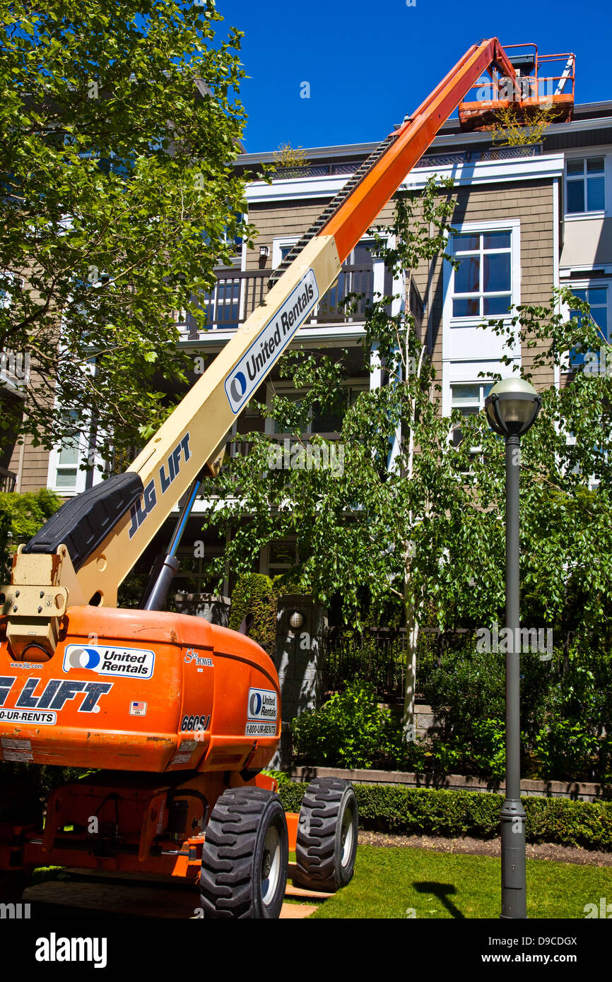 An extension boom lift used to access a roof Stock Photo Alamy