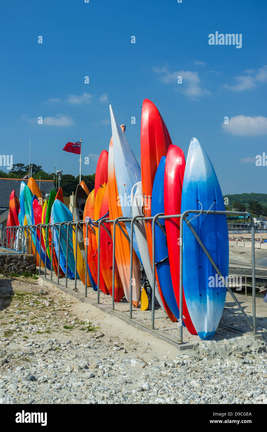 June 6th 2013. Lyme Regis, Dorset. Kayaks stacked up ready for hire at