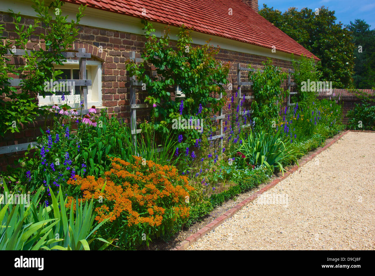 Flowers line the wall of a garden building in George Washington's Mount Vernon plantation. Stock Photo